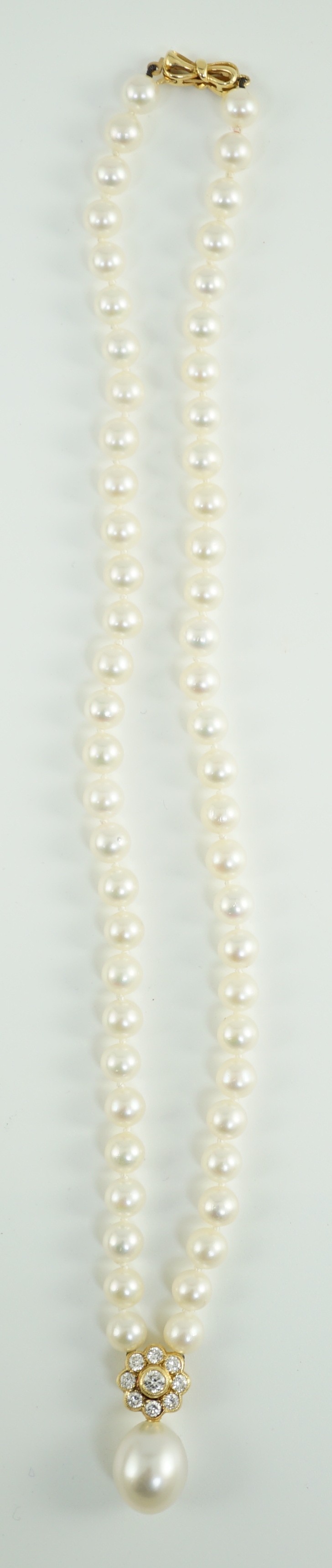 A late 1990's single strand cultured pearl and diamond cluster set necklace